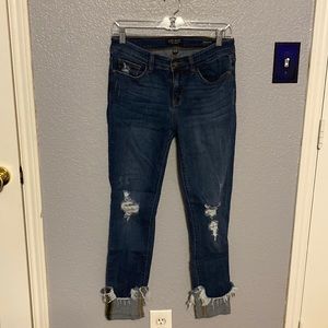 Judy Blue jeans. Skinny fit. Distressed. Down to the ankle. Raw hem is sewn up.